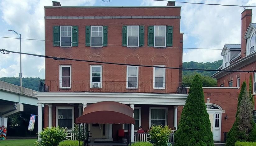 The PEN Drop-In Center building at 514 Somerset Street, Johnstown PA — a three-story red brick historic building